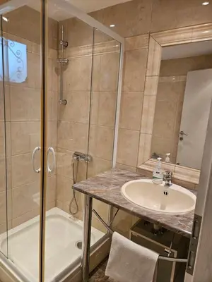 a bathroom with a sink and a shower at Villa Amela Dubrava in Bar