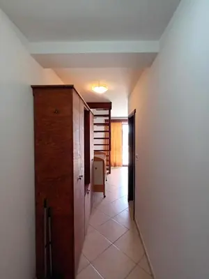 a hallway with a room with a door and a table at Beli angel in Rafailovici