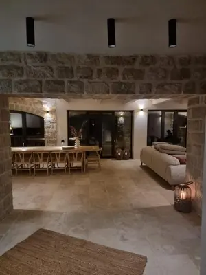 a living room with a couch and a table at Villa Drobni Pijesak in Budva