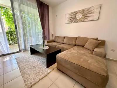 a living room with a couch and a table at Sun Bay Petrovac in Petrovac na Moru
