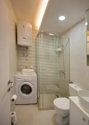 a bathroom with a washing machine and a shower at Lola - New, best located, elegant & super tidy in Kotor