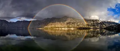 a rainbow over a mountain in the middle of a lake at Lola - New, best located, elegant & super tidy in Kotor