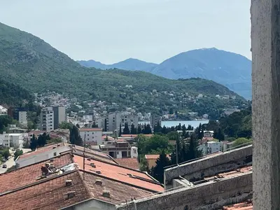 a view of a city with mountains in the background at Apartment Rumi Sutomore in Sutomore