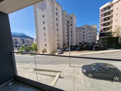 a view from a window of a parking lot with a car at MilLaz Apartman in Becici