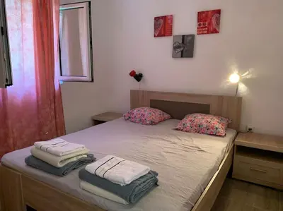 a bedroom with a bed with towels on it at Kite paradise - Ground floor for 5, Velika plaza- Long Beach in Ulcinj