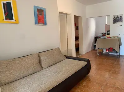 a living room with a couch and a table at Kite paradise - Ground floor for 5, Velika plaza- Long Beach in Ulcinj