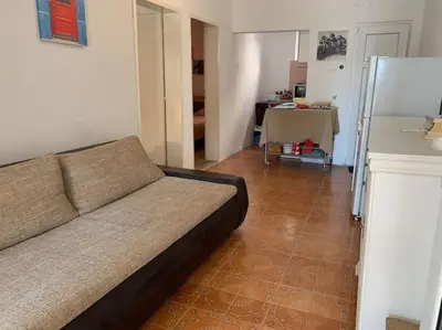 a living room with a couch and a table at Kite paradise - Ground floor for 5, Velika plaza- Long Beach in Ulcinj