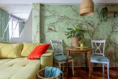 a living room with a couch and a table and chairs at Centre Budva Green in Budva