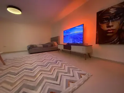 a living room with a large flat screen tv at Podgorica 23 in Podgorica