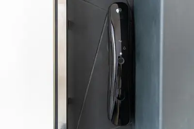 a close up of a refrigerator door with its reflection at Royal Oasis Seaview - Sveti Stefan in Sveti Stefan