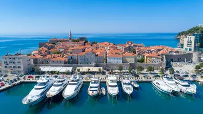 a bunch of boats are docked in a harbor at Apartment Simanic in Budva