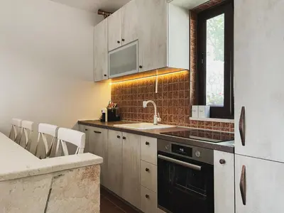 a kitchen with a sink and a stove at Cozy Karuč Home in Cetinje