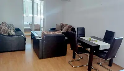 a living room with a couch and a table at Studio Apartment Iva in Budva