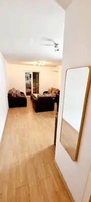 a living room with two couches and a mirror at Studio Apartment Iva in Budva