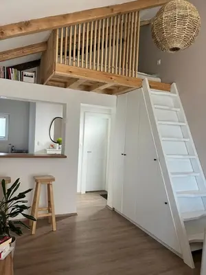 a room with a loft bed and a staircase at Guest house TAK in Cetinje