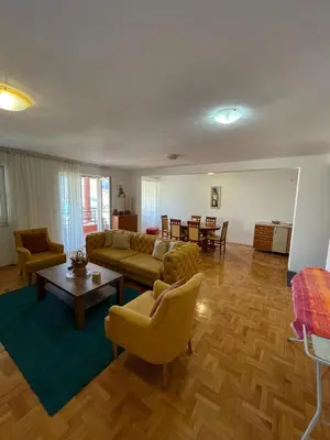a living room with a couch and chairs and a table at Bela Vista in Budva