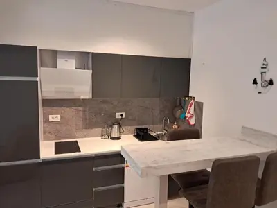 a kitchen with a sink and a counter top at VLSB Bečići in Becici