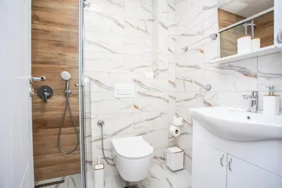 a bathroom with a toilet and a sink at Apartments NIKOS FAMILY in Ulcinj