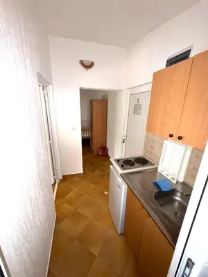 a small kitchen with a sink and a stove at ADO Apartmani Ulcinj Velika Plaza Donji Stoj in Donji Štoj