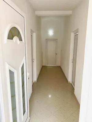 an empty hallway with a door and a tile floor at ADO Apartmani Ulcinj Velika Plaza Donji Stoj in Donji Štoj
