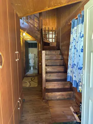 a staircase leading to a bathroom with a toilet at Velicanka hostel in Ulcinj