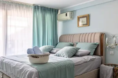 a bedroom with a bed with a basket on it at Center Blue & Green in Budva