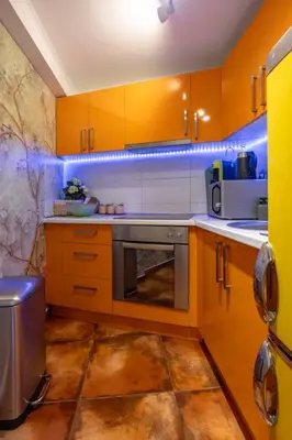 a kitchen with wooden cabinets and a stainless steel oven at Center Blue & Green in Budva