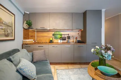 a living room with a couch and a table at Center Blue & Green in Budva