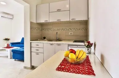 a bowl of fruit on a counter in a kitchen at MarBok Apartments with SeaView in Utjeha