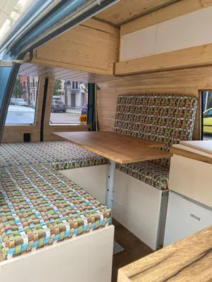 a table and chairs in the back of a van at GoCamping Montenegro in Cetinje