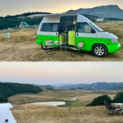 a green and white van parked in a field at GoCamping Montenegro in Cetinje