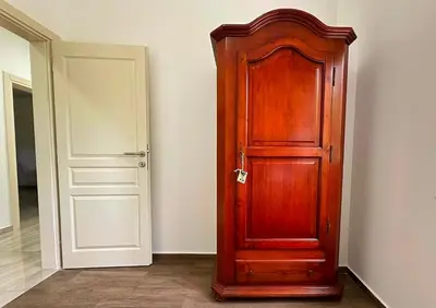 a wooden door in the corner of a room at Apartmani Suvodoli in Rvaši