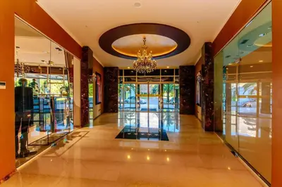 a hallway of a building with a chandelier at Luxury 3 bedroom flat in Tre canne hotel next to the beach in Budva