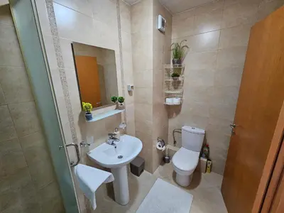 a bathroom with a toilet and a sink at Luča apartman in Podgorica