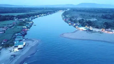 an aerial view of a beach and the water at Estuary Cottage Ada Bojana in Ulcinj