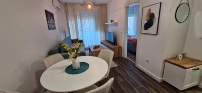 a living room with a white table and chairs at Zira2 in Kotor