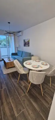 a living room with a table and chairs and a couch at Zira2 in Kotor