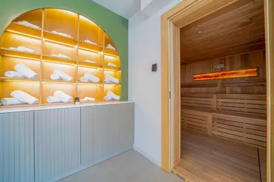 a walk in closet with wood paneling and a large window at Exclusive Hotel in Budva