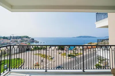 a balcony with a view of the ocean at Exclusive Hotel in Budva