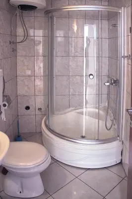 a bathroom with a shower and a toilet at Vera Apartments in Budva