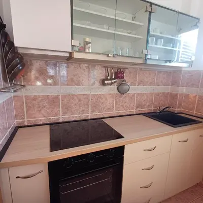 a kitchen with a sink and a counter top at Sea breeze Budva in Budva