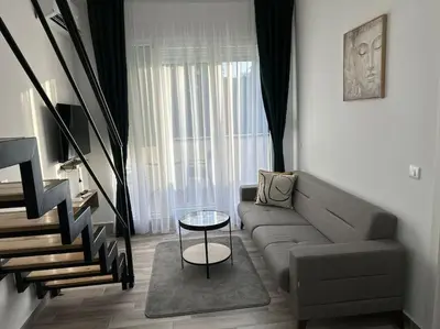 a living room with a couch and a table at Zira in Kotor
