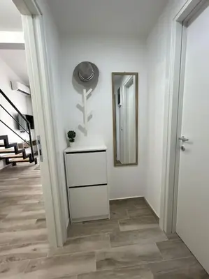 a hallway with a mirror and a dresser at Zira in Kotor