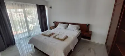 a bedroom with a bed with two pillows on it at Sea Cliff Villa in Bar