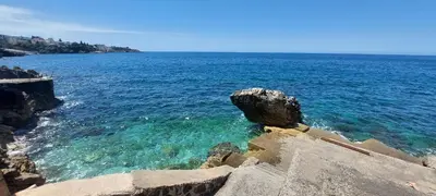 a view of the ocean with a rock in the water at Sea Cliff Villa in Bar