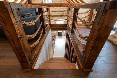 a set of stairs in a building with ropes at Seaside Stone House - Bella Vista in Kotor