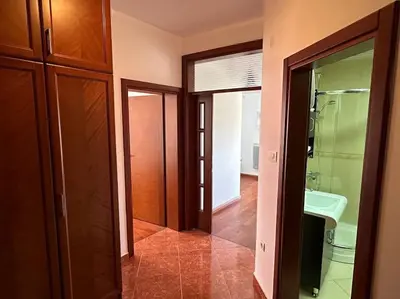 a bathroom with two glass doors and a sink at Sasha's apartment in Bar