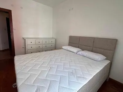 a bedroom with a large white bed in a room at Sasha's apartment in Bar