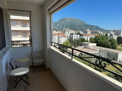 a balcony with a window with a view of a city at Sasha's apartment in Bar