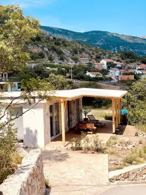 a small house with a pavilion on a hill at Chalet Elli's Mountain View in Velje Selo